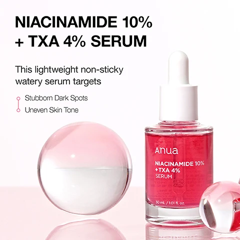 Image 1 - A glass dropper bottle labeled Niacinamide 10% + TXA 4% Serum is shown next to a clear glass orb, with text stating This lightweight non-sticky watery serum targets Stubborn Dark Spots and Uneven Skin Tone and the brand name Anua.
Image 2 - Image shows three sections with skincare ingredients and benefits: the first features pink droplets with the text 10% Niacinamide Helps to even out skin tone for clearer skin, the second displays splashing water with the text Hyaluronic Acid + Polygutamic Acid Hydrates and soothes the skin, and the third shows a creamy white texture with the text Ceramides Helps to strengthen the skin barrier.
Image 3 - A pink serum bottle labeled Anua Niacinamide 10% + TXA 4% Serum is shown with some serum spilled on a white surface, accompanied by text stating Gentle Yet Effective Formula, Designed for all skin types, Perfect for sensitive ones, No Fragrance, Tested No Irritation.
Image 4 - Image shows a skincare infographic titled THE POWERFUL TRIO OF ACTIVE INGREDIENTS featuring three active ingredients with their percentages and benefits: 10% Niacinamide helps reduce discoloration by breaking down excess melanin, 4% TXA visibly fades existing dark spots and prevents new ones by interrupting melanin production, and 2% Arbutin corrects uneven skin tone by limiting melanin production.