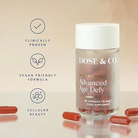 Image 1 - A bottle filled with red capsules is shown with several loose red capsules on a surface, next to three icons with the text Clinically Proven, Vegan Friendly Formula, Cellular Beauty, and the bottle has text Dose & Co. Beauty is Cellular Advanced Age Defy Skin Renewing Capsules 30 Capsules 18.54g e Food Supplement. Image 2 - Image shows a bottle of Dose & Co. Advanced Age Defy Skin Renewing Capsules with several orange capsules, with text reading REDUCE FINE LINES & WRINKLES* *based on a randomised, double-blind, placebo controlled study in 65 healthy females taking 5% w/w astaxanthin Haematococcus pluvialis extract daily for 16 weeks. DOSE & CO. BEAUTY IS CELLULAR Advanced Age Defy SKIN RENEWING CAPSULES 30 CAPSULES | 18.54g FOOD SUPPLEMENT.