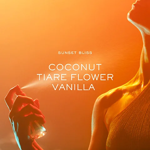 A close-up of a hand holding a spray bottle, with a warm orange background and the text SUNSET BLISS, COCONUT, TIARE FLOWER, VANILLA displayed prominently.